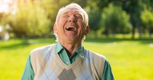 Psychology reveals why the loudest laughers often survived the hardest childhoods